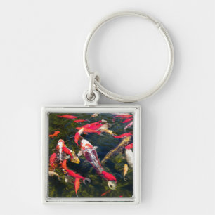 Many koi carp on the water surface keychain