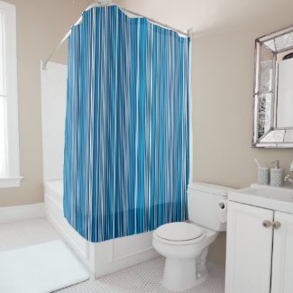 Many multi colored stripes in the blue shower curtain