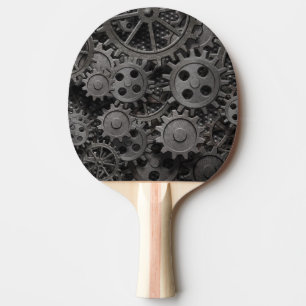 Many old rusty metal gears or machine parts Ping-Pong paddle