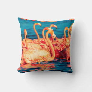 Many pink coral beautiful wild flamingos in blue l throw pillow