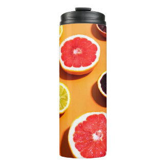 Many variety citrus fruits pattern in sunlight on thermal tumbler