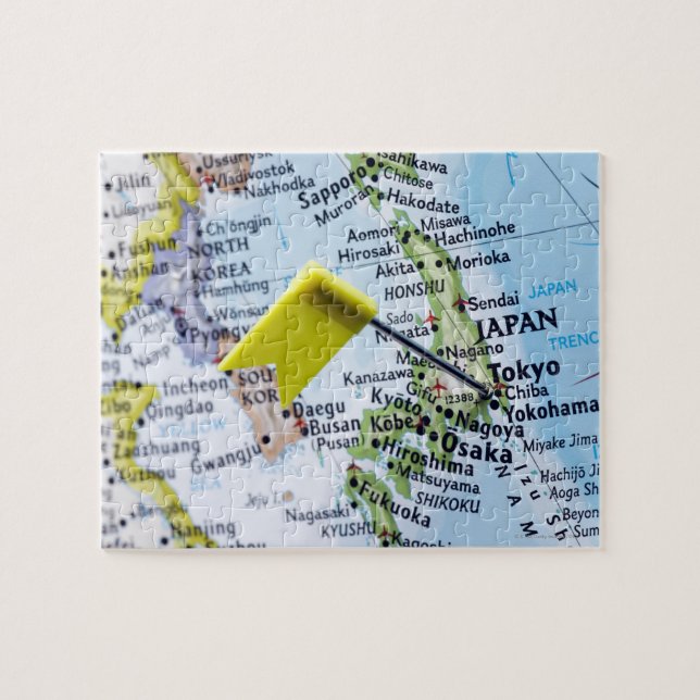 Map pin placed in Tokyo, Japan on map, close-up Jigsaw Puzzle (Horizontal)