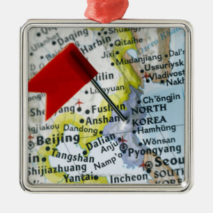 Map pin placed on North Korea on map, close-up Metal Ornament