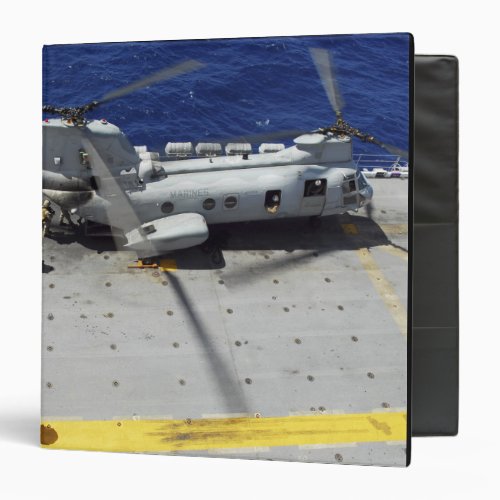 Marines board a CH_46E Sea Knight helicopter Binder