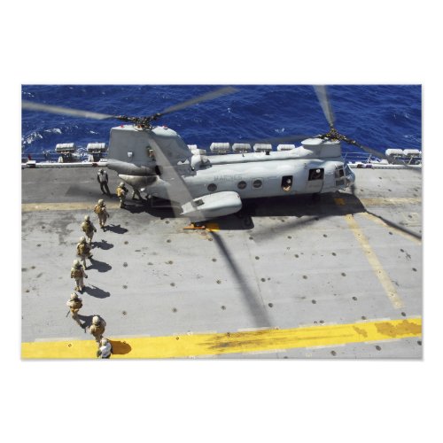 Marines board a CH_46E Sea Knight helicopter Photo Print