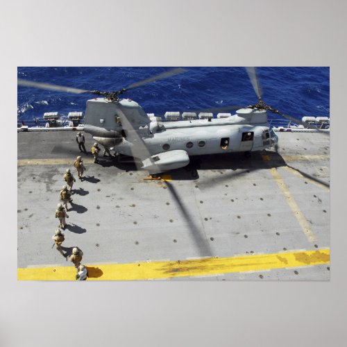 Marines board a CH_46E Sea Knight helicopter Poster