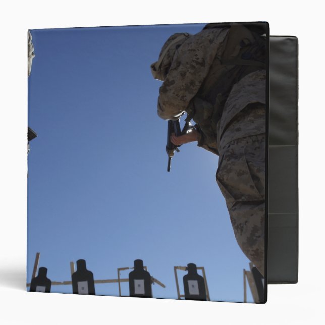 Marines change magazines in the midst of firing binder (Front/Inside)