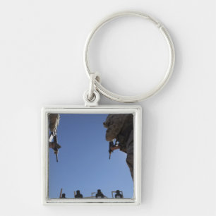 Marines change magazines in the midst of firing keychain