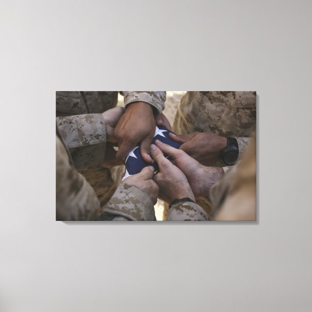 Marines fold an American flag Canvas Print (Front)