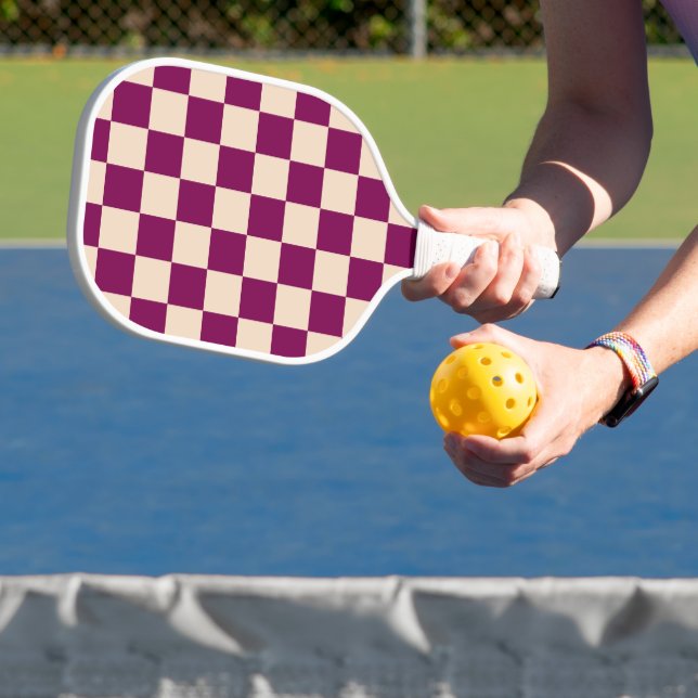 Maroon and beige checkerboard pattern pickleball paddle (Insitu)