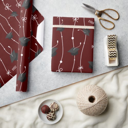 Maroon Graduation Caps and Ribbon Wrapping Paper