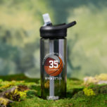 Maroon gray basketball team colors boys girls  water bottle<br><div class="desc">This team colors basketball themed water bottle is suitable for boys or girls and features the realistic image of a basketball that has two recolored panels--one maroon and one gray--upon which you can personalize the athlete's name and jersey number - their custom school or club name encircles the top of...</div>