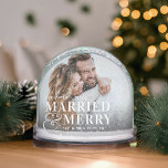 Married & Merry Wedding Photo Snow Globe<br><div class="desc">Mark the magic of your first Christmas together with this personalized Married & Merry snow globe by Redwood & Vine Design Co. Both sides feature your chosen wedding photo, names, and the phrase Married & Merry in elegant type, creating a beautiful double-sided display. A meaningful holiday keepsake or heartfelt gift...</div>