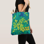 Marsh Marigold Summer Wildflowers Floral Painting  Tote Bag<br><div class="desc">Tote bag featuring colorful floral painting based on life sketch. Beautiful marsh marigold flower,  huge burdock leaf of and dandelion buds. Color palette: golden and lemon yellow,   turquoise,  teal,  green and blue colors. acrylic on paper,  2022
© Julia Khoroshikh 
www.juliakhoroshikh.art 
#floralpainting #marshmarigold #caltha #totebags #totes #floralaccessories #floralprint #florals #wildflowers</div>