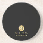 Masculine Black and Gold Personalized Groomsmen Coaster<br><div class="desc">Add a personal touch to your wedding with personalized groomsmen coaster. This coaster features black monogram in gold circle element with name and title in gold professional font style on black background. Also perfect for best man, father of the bride and more. Please Note : The foil details are simulated...</div>