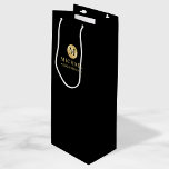 Masculine Black and Gold Personalized Groomsmen Wine Gift Bag<br><div class="desc">Add a personal touch to your wedding with personalized groomsmen gift bag. This gift bag features black monogram in gold circle element with name and title in gold professional font style on black background. Also perfect for best man, father of the bride, ring bearer and more. Please Note : The...</div>