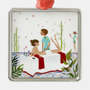 Massage therapist massaging a woman lying on a metal ornament