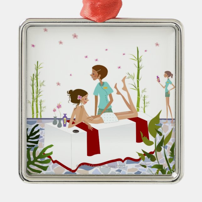 Massage therapist massaging a woman lying on a metal ornament (Front)