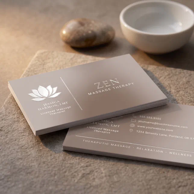 A spot UV business card with a taupe color scheme and a lotus flower motif.