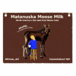 Matanuska Moose Milk Sign Cutout<br><div class="desc">An old, wooden sign from the world famous and entirely mythical Matanuska Moose Milk dairy farm in Willow Alaska; not too far from Anchorage. The image features a milkmaid hand milking Matilda, the farm's first dairy moose. Believe it or not there are moose dairies; a small number in Russia and...</div>