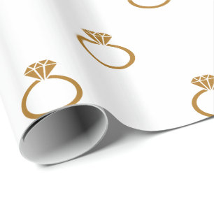 Matte Gold Engagement Rings on White Wrapping Paper