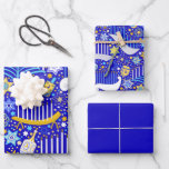 Maximal Hanukkah Wrapping Paper Sheets<br><div class="desc">Colorful dreidels,  menorahs,  and stars on a rich blue background. One sheet each of large and small print,  and one sheet of solid blue.</div>