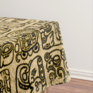Mayan and aztec glyphs gold on vintage texture tablecloth