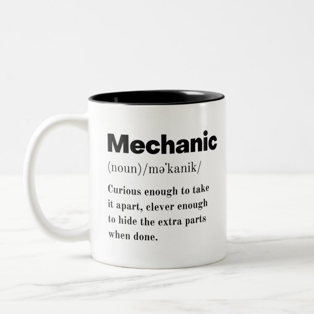 Mechanic. I Fix Car Funny Misspelling Mechanical Two-Tone Coffee Mug (Left)