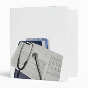 medical stethoscope on cardiogram EKG readings Binder
