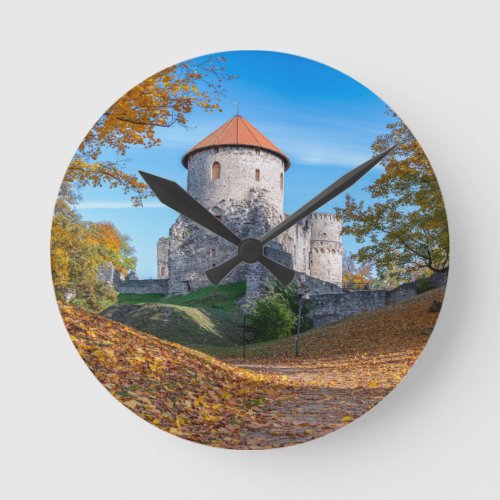 Medieval castle surrounded by forest round clock