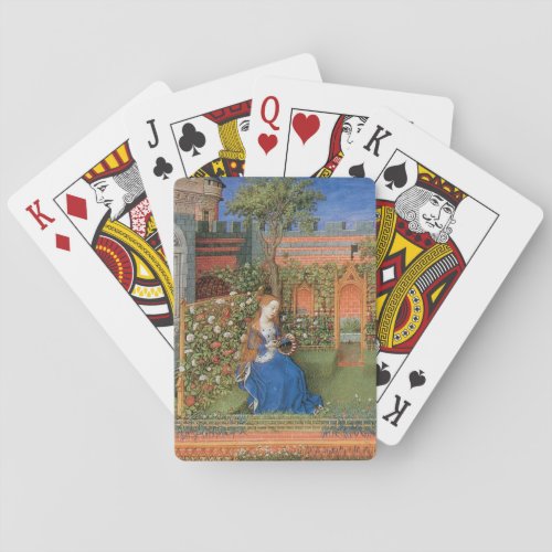 Medieval lady in rose garden playing cards