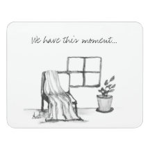Meditation chair by window with plant and throw