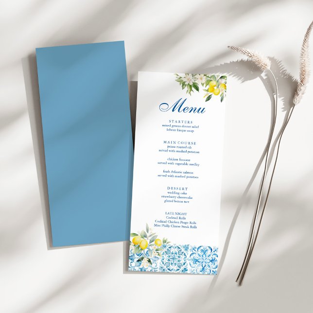 Mediterranean Lemon Blue Tile Wedding Menu (Mediterranean Blue Tiles & Lemon Wedding Menu on a sunny white table.)