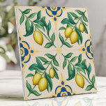 Mediterranean Lemon Citrus Fruit  Ceramic Tile<br><div class="desc">Bring the warmth of the Mediterranean to your home with this vibrant ceramic tile. The design features bright yellow lemons and lush green leaves on a cream background, accented by classic blue and yellow geometric details. This cheerful and sunny pattern is perfect for kitchens, bathrooms, patios, or any space that...</div>