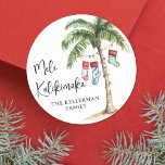 Mele Kalikimaka Beach Christmas Classic Round Sticker<br><div class="desc">Get into the holiday spirit with this festive watercolor Christmas sticker featuring a large palm tree wrapped in colorful Christmas lights. Three holiday stockings hang playfully from the fronds, with soft beach sand at the base for a warm, tropical touch. The hand-painted look adds charm and personality, while the mix...</div>