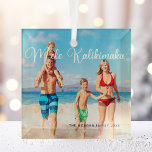 Mele Kalikimaka Family Photo Beach Christmas 2022 Glass Ornament<br><div class="desc">This pretty beach Christmas ornament features your own summer vacation photo from the coast with an elegant typography overlay in white that reads Mele Kalikimaka. A cute Hawaiian way to say Merry Christmas in style on a tropical island. Take me to the ocean this holiday.</div>