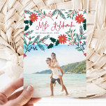 Mele Kalikimaka | Hawaiian Christmas Photo Holiday Card<br><div class="desc">Send holiday greetings to friends and family, island-style, with our tropical holiday photo cards. Design features your favorite photo with the Hawaiian Christmas greeting "Mele Kalikimaka" in red hand lettered typography, flanked by vibrant red poinsettia flowers and holly leaves that cascade over your photo. Personalize with your names and the...</div>
