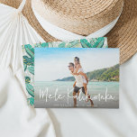 Mele Kalikimaka | Hawaiian Holiday Photo Card<br><div class="desc">Chic full bleed horizontal or landscape-oriented holiday photo card features "Mele Kalikimaka, " the Hawaiian Christmas greeting, in casual white hand lettered script typography as an overlay on your favorite beach or vacation photo. Personalize with your custom holiday message, the year, and your family name beneath. Cards reverse to a...</div>
