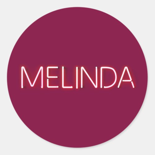 Melinda name in glowing neon lights classic round sticker