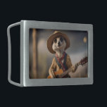 Melodies of the Savanna A Meerkat Guitar Serenade, Belt Buckle<br><div class="desc">Under the golden sun of the African savanna, a female meerkat gracefully holds a guitar with poised determination. Her slender paws expertly strum the strings, creating melodies that float through the air, blending with the sounds of distant wildlife. She’s dressed in a simple yet stylish scarf and hat, and her...</div>