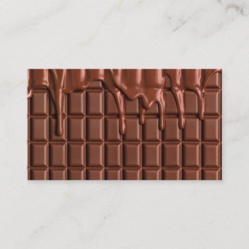 Melted chocolate dripping over a chocolate block business card