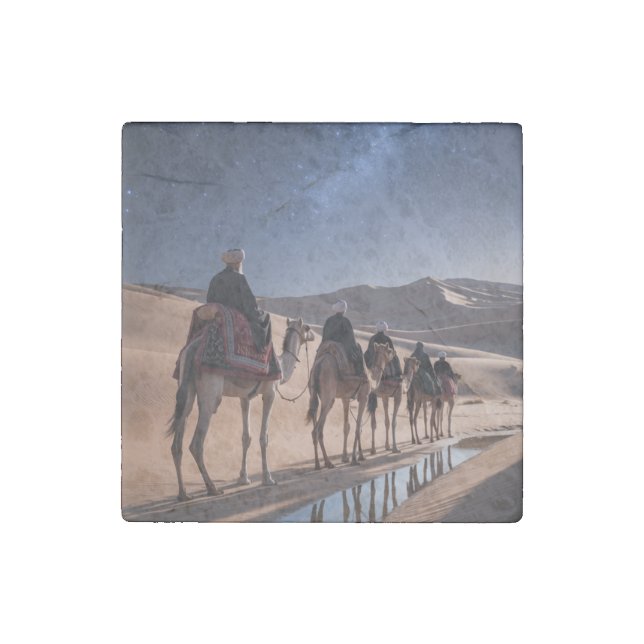 men riding camels across a desert night  stone magnet (Front)