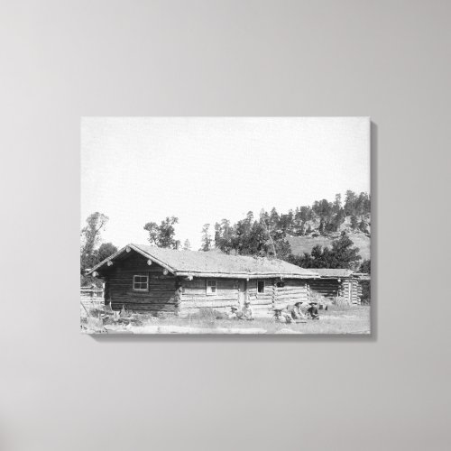 Men Sitting outside Log Cabin in South Dakota Canvas Print