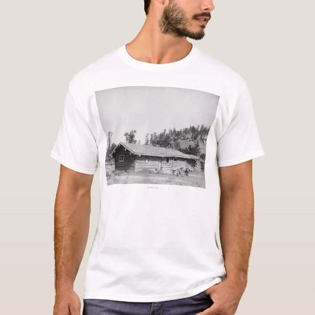 Men Sitting outside Log Cabin in South Dakota T-Shirt (Front)