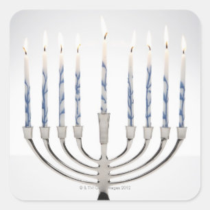 Menorah with burning candles square sticker