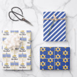 Menorah with Lights Happy Hanukkah Wrapping Paper<br><div class="desc">Great for celebrating Hanukkah season, this design features our original menorah vector graphic with script text calligraphy, "Happy Hanukkah" greeting on the 1st sheet, a simple blue and white striped pattern on the 2nd sheet and a gold tone Star of David pattern on a blue background on the 3rd sheet....</div>