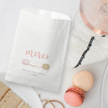 Merci French Macarons Bridal Shower Favor Bag<br><div class="desc">Fill these cute favor bags with sweet treats and thank your bridal shower guests in Parisian chic style. Design features "Merci" in peachy pink handwritten style lettering and a row of four delectable French macarons in pastel hues of pink, ivory, yellow and tan. Customize with the bride to be's name...</div>