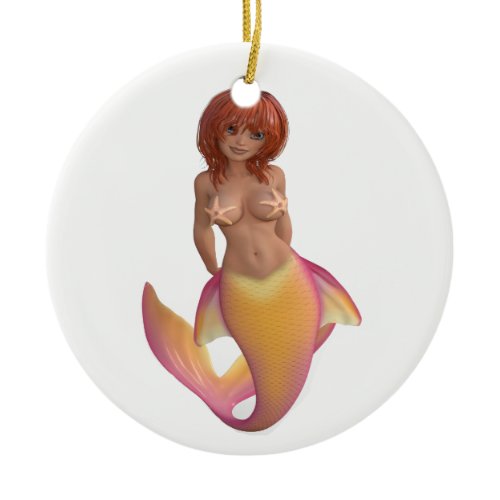 Mermaid water creature with a yellow and pink tail ceramic ornament