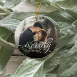 Merrily Ever After | Wedding Photo Ceramic Ornament<br><div class="desc">Elegant holiday photo ornament for newlyweds features a favorite wedding photo on each side,  with "Merrily Ever After" overlaid in white calligraphy script. Personalize with your names and wedding date on the back.</div>