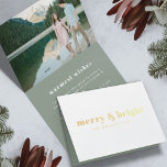 Merry and Bright | Modern Christmas Couple Photo Foil Card<br><div class="desc">A stylish modern holiday photo gold foil greeting card with a bold retro typography quote "merry & bright" in white with a dark sage forest green feature color on the inside. The greeting, name and message can be easily customized for a personal touch. A trendy, minimalist and contemporary design to...</div>